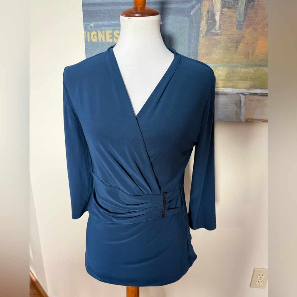 White House Black Market Woman’s blue top size med.